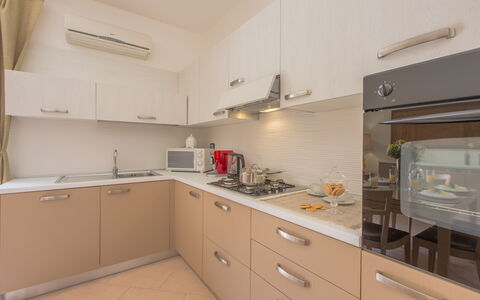 La Nuvola Sui Pedali: Kitchen, Kitchen Appliance, Countertop, Major Appliance, Wood, Cabinetry, Flooring, Interior Design, Kitchen Stove, Sink