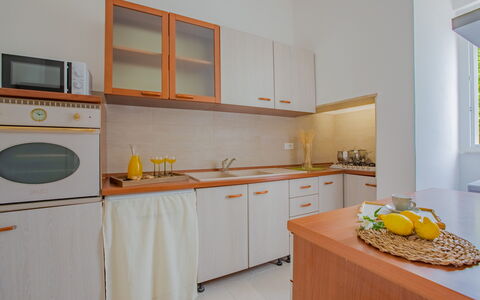 Villa Vera: Interior Design, Flooring, Wood, Kitchen, Furniture, Countertop, Floor, Kitchen Appliance, Major Appliance, Room
