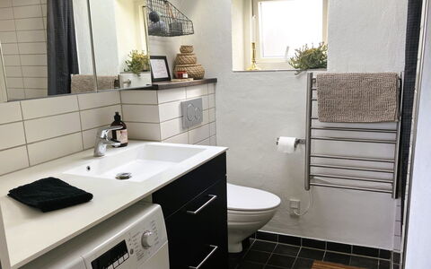 Carlene - 350M from the Sea: Flooring, Interior Design, Floor, Plumbing Fixture, Bathroom, Toilet, Sink, Bathroom Cabinet, Plumbing, Tile