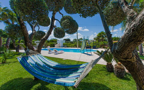 Trullo Poggio Con Piscina: Blue, Tree, Shade, Leisure, Lawn, Garden, Swimming Pool, Resort, Eco Hotel, Landscaping