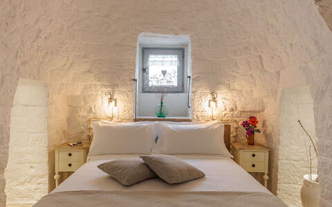 Masseria Le Monache: Ceiling, Light Fixture, Bedroom, Bed, Lamp, Pillow, Bedding, Hotel, Throw Pillow