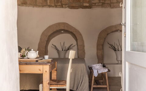 Masseria Le Monache: Furniture, Interior Design, Room, Chair, Natural Material, Linens, Wood Stain, Hardwood, Houseplant, Pillow