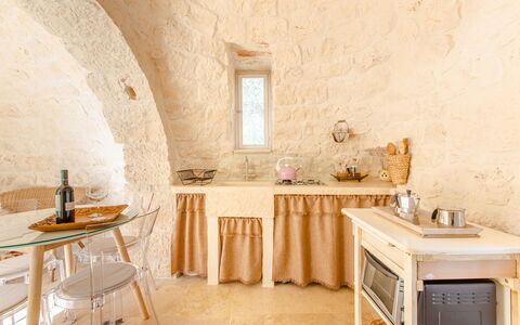 Trullo Della Quercia: Interior Design, Furniture, Ceiling, Room, Chair, Light Fixture, Plaster, Linens, Houseplant, Wood Flooring