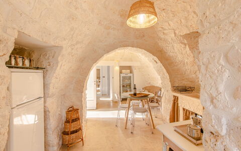 Trullo Della Quercia: Wall, Ceiling, Interior Design, Room, Design, Light Fixture, Plaster, Attic, Wood Flooring, Hotel