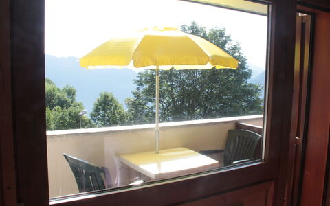 T du Morel a: Furniture, Outdoor Furniture, Chair, Shade, Outdoor Table, Balcony, Wood Stain, Umbrella, Eco Hotel, Hardwood