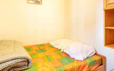 Les Eterlous: Bed, Bedroom, Wall, Bed Sheet, Bedding, Furniture, Wood, Interior Design, Floor, Yellow