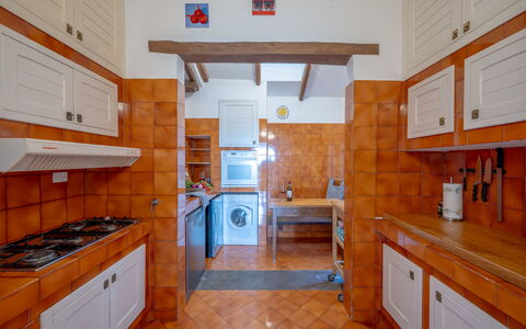 Villa Argentina: Kitchen, Flooring, Countertop, Wood, Interior Design, Major Appliance, Floor, Kitchen Appliance, Cabinetry, Furniture