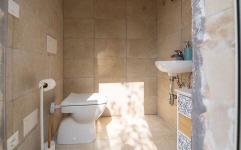 Villa Prestige: Toilet Seat, Wall, Plumbing Fixture, Flooring, Bathroom, Toilet, Floor, Plumbing, Interior Design, Ceramic