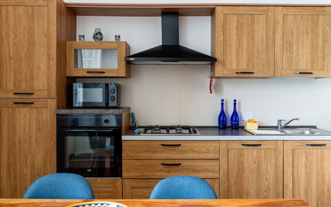 Casa Sole Mare: Wood, Kitchen, Cabinetry, Furniture, Kitchen Appliance, Major Appliance, Kitchen Stove, Gas Stove, Stove, Countertop
