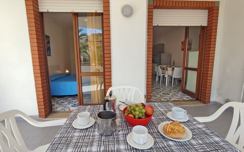 Appartamenti Della Rosa Seaside Abruzzo: Furniture, Chair, Wood Stain, Shade, Outdoor Furniture, Kitchen & Dining Room Table, Houseplant, Balcony, Outdoor Table