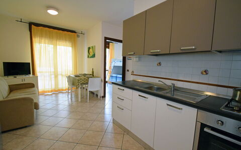 Appartamenti Della Rosa Seaside Abruzzo: Flooring, Interior Design, Floor, Furniture, Countertop, Kitchen, Room, Kitchen & Dining Room Table, Ceiling, Chair