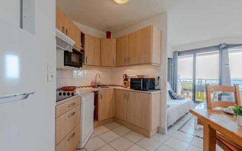 Sombrero: Apartment, Furniture, Chair, Major Appliance, Hardwood, Design, Balcony, Wood Stain, Cabinetry, Kitchen