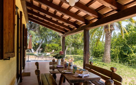 Casa Iume: Wood, Furniture, Table, Shade, Chair, Resort, Outdoor Furniture, Porch, Cottage, Wood Stain