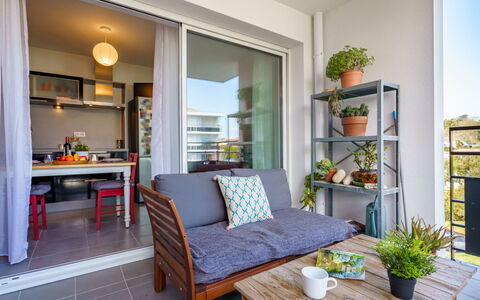 Résidence Liliak: Blue, Chair, Outdoor Furniture, Design, Shade, Outdoor Table, Eco Hotel, Patio, Houseplant, Daylighting