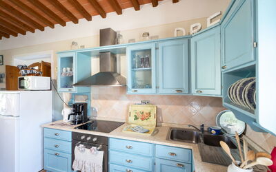 San Regolo 915.2: Blue, Furniture, Kitchen, Interior Design, Cabinetry, Wood, Kitchen Appliance, Countertop, Flooring, Major Appliance