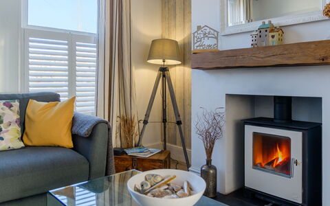 Chy an Mor: Hearth, Flooring, Interior Design, Furniture, Floor, Living Room, Home, Room, Wood-Burning Stove, Couch