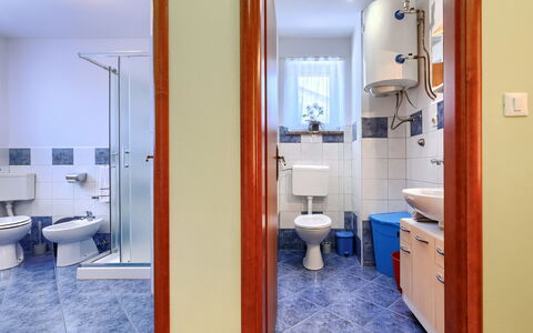 Soriso: Flooring, Floor, Plumbing Fixture, Interior Design, Bathroom, Toilet, Plumbing, Room, Tile, Toilet Seat