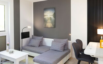 Sandmann 100.1: Furniture, Interior Design, Flooring, Floor, Home, Room, Apartment, Lighting, Living Room, Couch