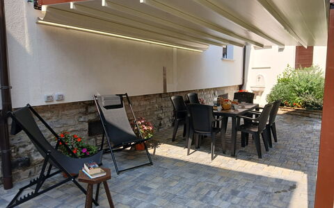 Irene: Awning, Shade, Flowerpot, Outdoor Structure, Wood Stain, Houseplant, Patio, Design, Hardwood, Outdoor Furniture