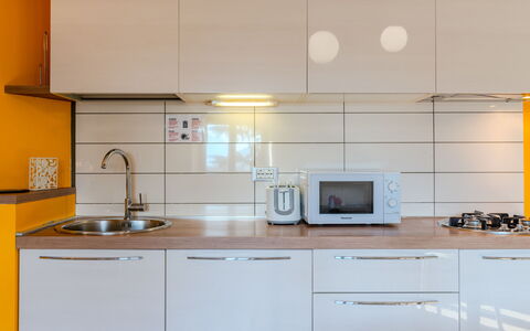 Lidia: Countertop, Kitchen, Kitchen Appliance, Cabinetry, Major Appliance, Interior Design, Flooring, Wood, Kitchen Sink, Furniture