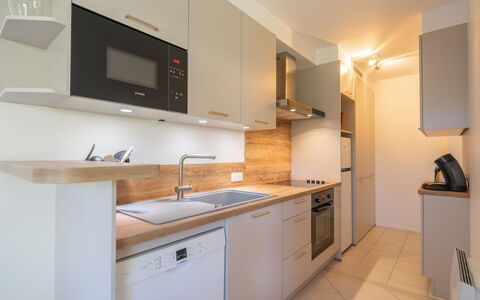 Résidence de Mons: Countertop, Kitchen, Interior Design, Kitchen Appliance, Cabinetry, Flooring, Major Appliance, Furniture, Wood, Floor