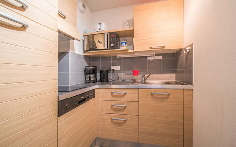 C. du Verdon: Kitchen, Countertop, Cabinetry, Interior Design, Kitchen Appliance, Flooring, Furniture, Wood, Major Appliance, Ceiling