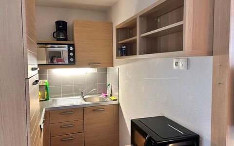 C. du Verdon: Kitchen, Countertop, Cabinetry, Interior Design, Kitchen Appliance, Flooring, Furniture, Wood, Major Appliance, Ceiling