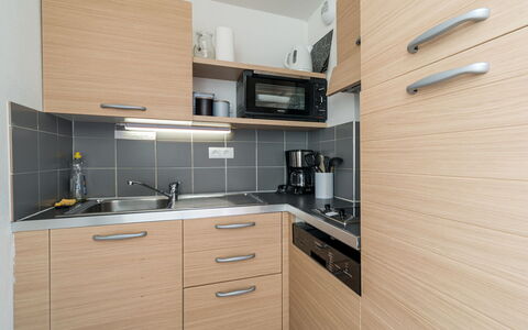 C. du Verdon: Countertop, Kitchen, Cabinetry, Wood, Interior Design, Kitchen Appliance, Major Appliance, Flooring, Sink, Kitchen Sink