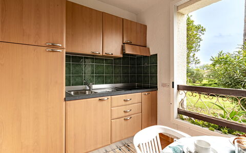 Casa Antonio: Interior Design, Flooring, Kitchen, Floor, Countertop, Room, Cabinetry, Ceiling, Wood Stain, Kitchen Appliance