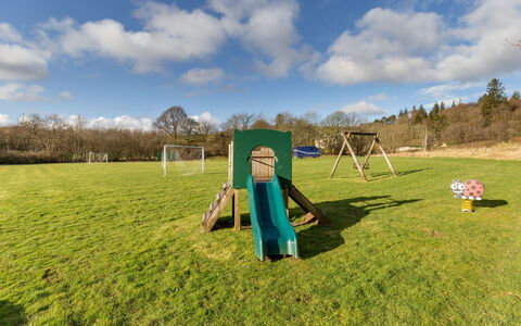 Doonans Cottage: Playground Slide, Outdoor Play Equipment, Lawn, Park, Garden, Playground, Shade, Yard, Landscaping, Chute