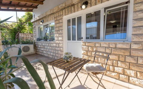 Appartamento Nomads, Ac, Wifi Hvar: Door, Brick, Shade, Chair, Houseplant, Outdoor Furniture, Flowerpot, Wood Stain, Siding, Balcony