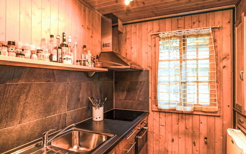 La Capsule: Wood, Ceiling, Floor, Flooring, Wood Stain, Hardwood, Room, Light Fixture, Log Cabin, Kitchen