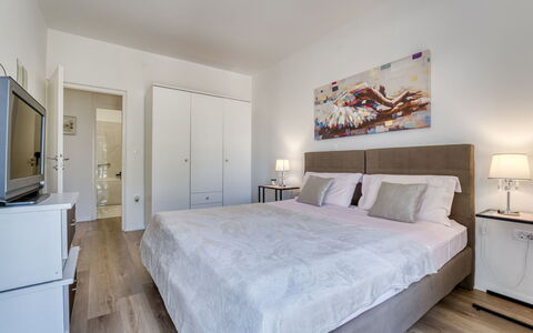 Villa Nika: Furniture, Bed, Interior Design, Flooring, Floor, Bedroom, Room, Wood, Ceiling, Bed Sheet