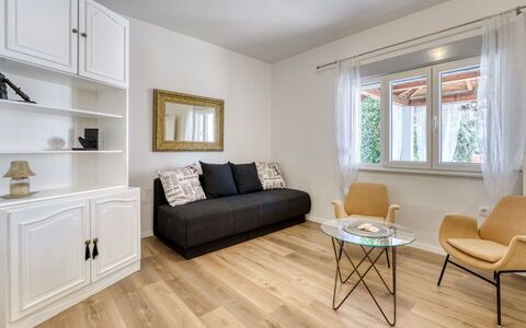 Villa Nika: Furniture, Wood Flooring, Interior Design, Flooring, Floor, Wood, Laminate Flooring, Couch, Living Room, Home