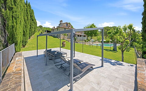 La Dimora del Chianti Dimora: Stunning Tuscan Ston: Composite Material, Furniture, Shade, Outdoor Furniture, Garden, Outdoor Structure, Concrete, Landscaping, Flagstone, Pergola
