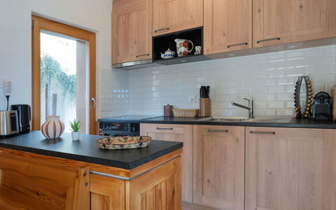 Le Katanga: Countertop, Cabinetry, Furniture, Kitchen, Flooring, Kitchen Appliance, Interior Design, Wood, Drawer, Cupboard