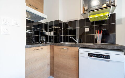 La Dune: Kitchen, Kitchen Appliance, Countertop, Major Appliance, Interior Design, Flooring, Cabinetry, Floor, Room, Home Appliance