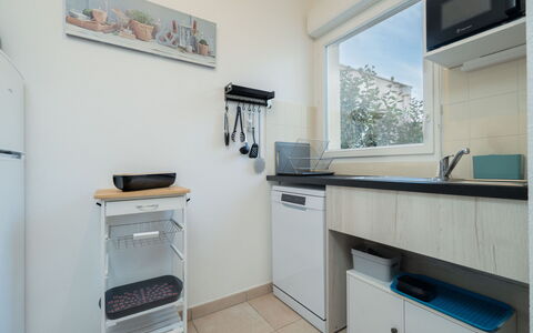 La Dune: Major Appliance, Kitchen, Kitchen Appliance, Interior Design, Countertop, Furniture, Flooring, Room, Cabinetry, Floor