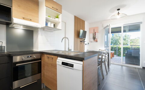 La Dune: Furniture, Interior Design, Countertop, Kitchen, Flooring, Cabinetry, Major Appliance, Floor, Apartment, Home