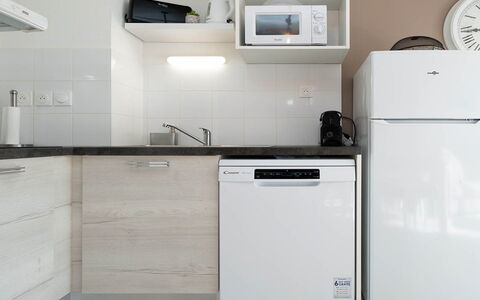 La Dune: Kitchen Appliance, Kitchen, Major Appliance, Home Appliance, Cabinetry, Countertop, Interior Design, Room, Refrigerator, Flooring