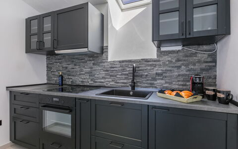 Mapo: Furniture, Wood, Interior Design, Flooring, Kitchen, Cabinetry, Floor, Room, Major Appliance, Cupboard