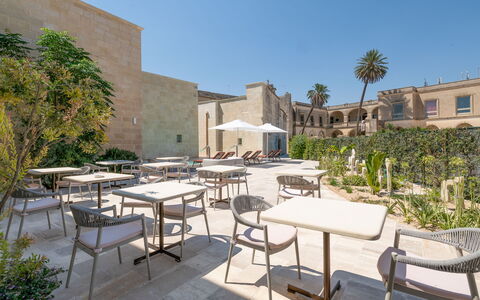 Palazzo Corte Dei Granai: Courtyard, Hacienda, Estate, Landscaping, Garden, Shade, Chair, Yard, Hotel