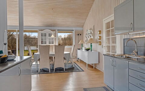 Tosti - 180M to the Fjord: Flooring, Interior Design, Wood, Kitchen, Ceiling, Floor, Furniture, Light Fixture, Wood Flooring, Countertop