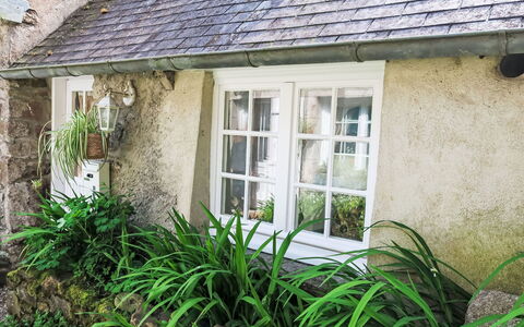 Gwenn Tiny House: House, Shrub, Cottage, Roof, Home, Groundcover, Garden, Stone Wall, Landscaping, Sash Window
