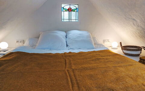 Gwenn Tiny House: Bedroom, Bed, Bed Sheet, Wood, Bedding, Interior Design, Furniture, Linens, Floor, Flooring