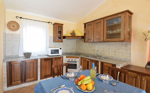 Belvedere Apartment Ac, Budoni: Furniture, Interior Design, Wood, Kitchen, Cabinetry, Countertop, Flooring, Ceiling, Room, Lighting