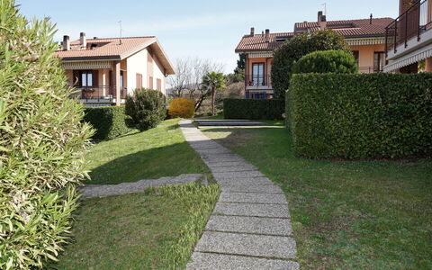Casa Rigo: Grass, Shrub, Residential Area, House, Home, Garden, Land Lot, Groundcover, Lawn, Landscaping