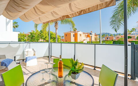 Las Dunas Oliva Nova: Furniture, Chair, Shade, Resort, Eco Hotel, Outdoor Furniture, Kitchen & Dining Room Table, Houseplant, Balcony