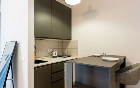 Modern Studio Nest: Residential Area, Shrub, Roof, Home, Cottage, Driveway, Estate, Siding, Landscaping, Yard