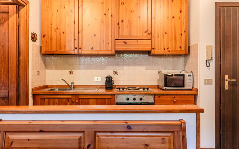 Deliziosa Mansarda: Wood, Interior Design, Cabinetry, Kitchen, Flooring, Ceiling, Furniture, Room, Floor, Wood Stain